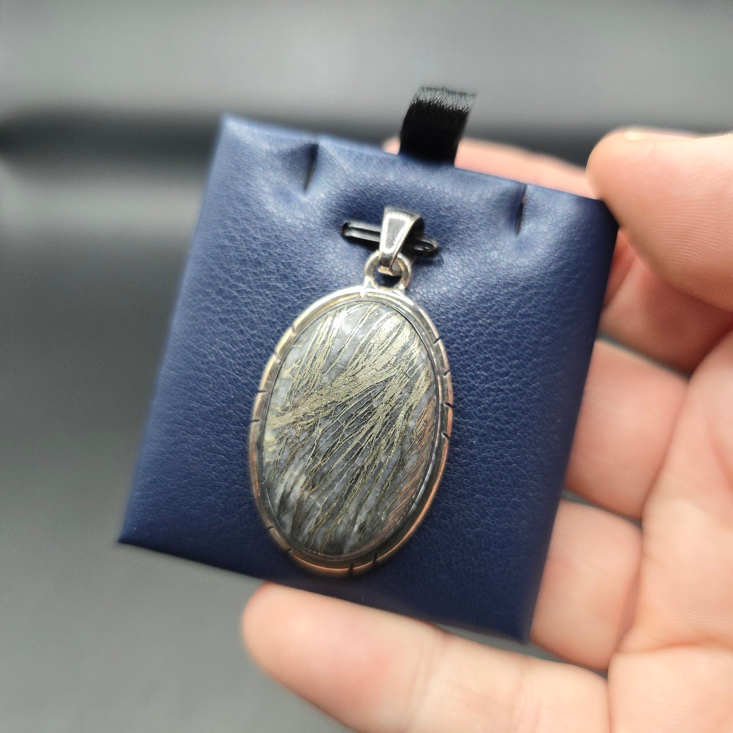 Marcasite in quartz pendant