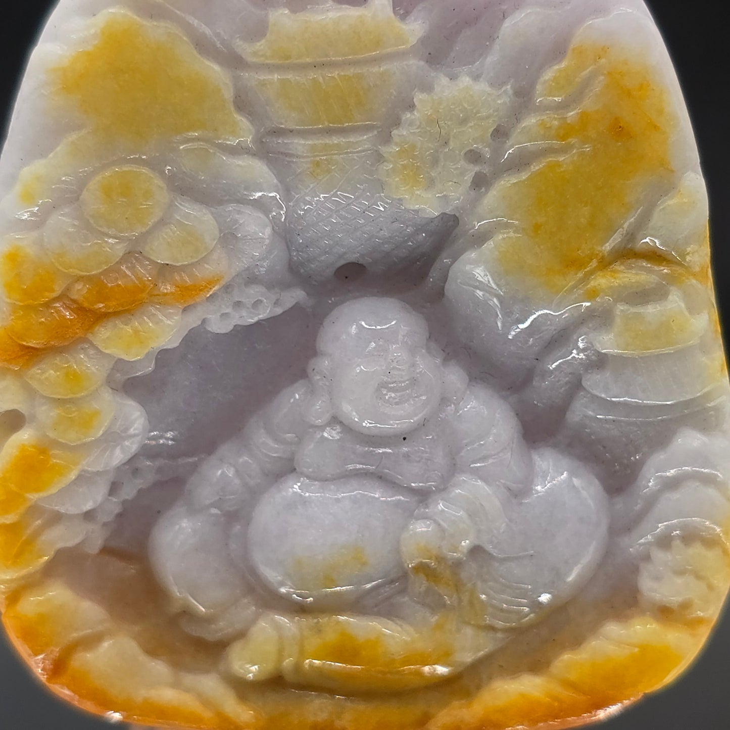 Lavender and yellow Jade Buddha carving