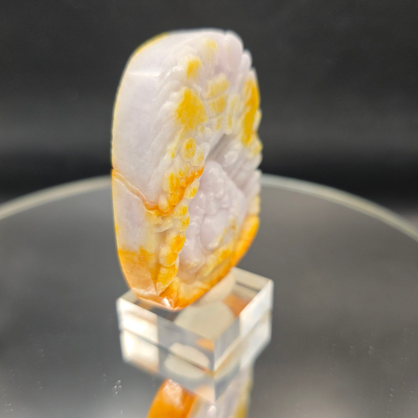 Lavender and yellow Jade Buddha carving
